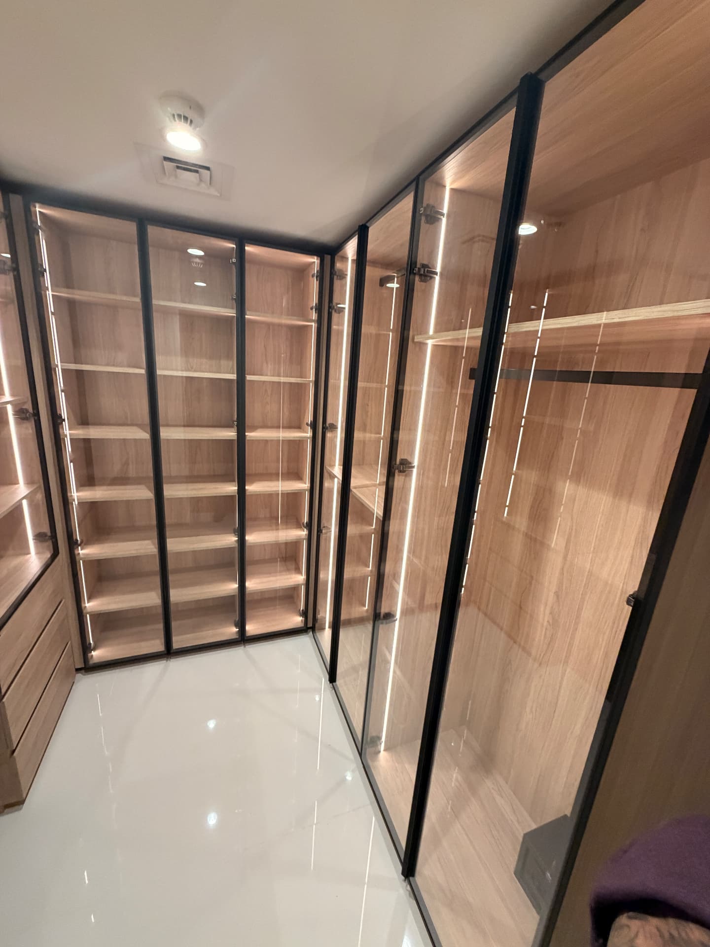 Full-height glass wardrobe wall